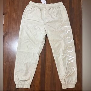 Nike Light Cream Jogger Sweatpants with Vertical 'SMOOSH' Logo